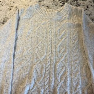Set of two women’s sweaters.